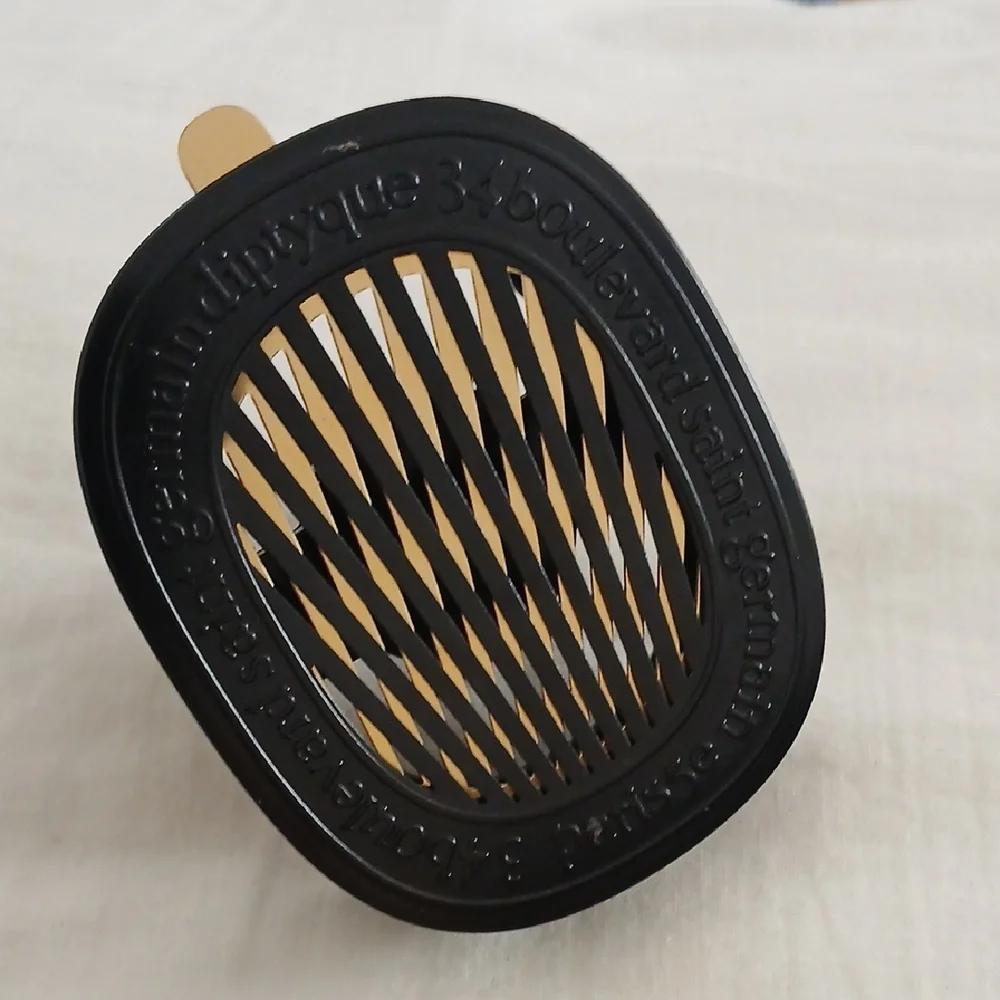 diptyque Black and Gold Oval Car Vent Diffuser - Picture 1 of 3